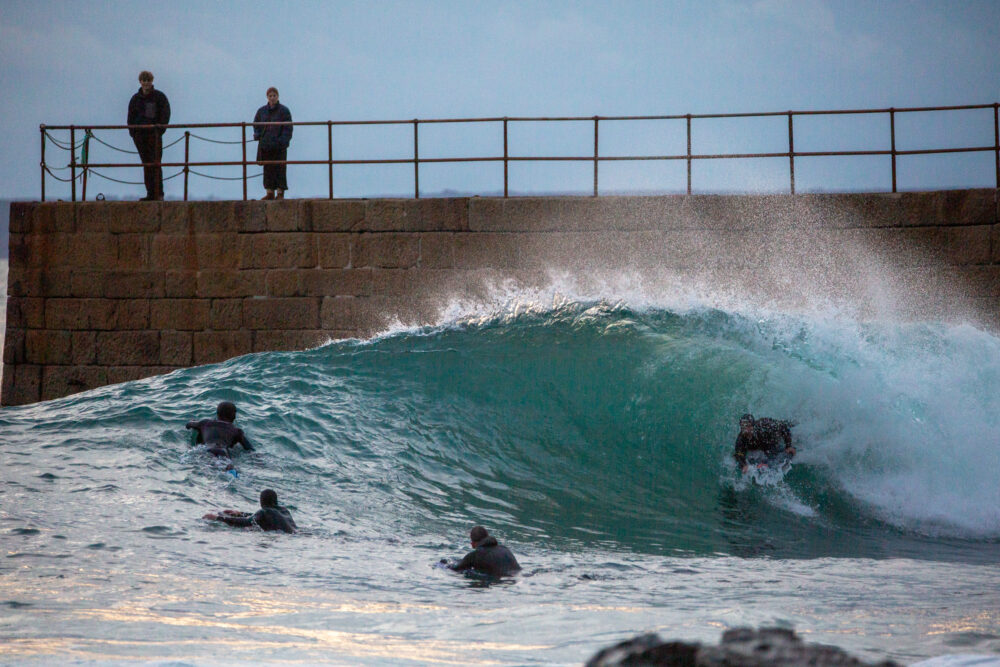 Porthleven pier - surfing - sunset